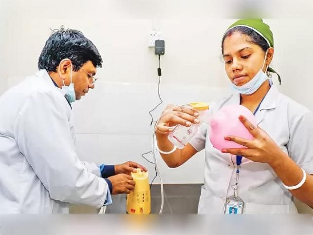 Physician (L) shows how to collect the breast milk at ICMH in Dhaka recently. The first human milk bank of the country was supposed to officially launch in Dhaka, but was halted amid protests. Prothom Alo file photo