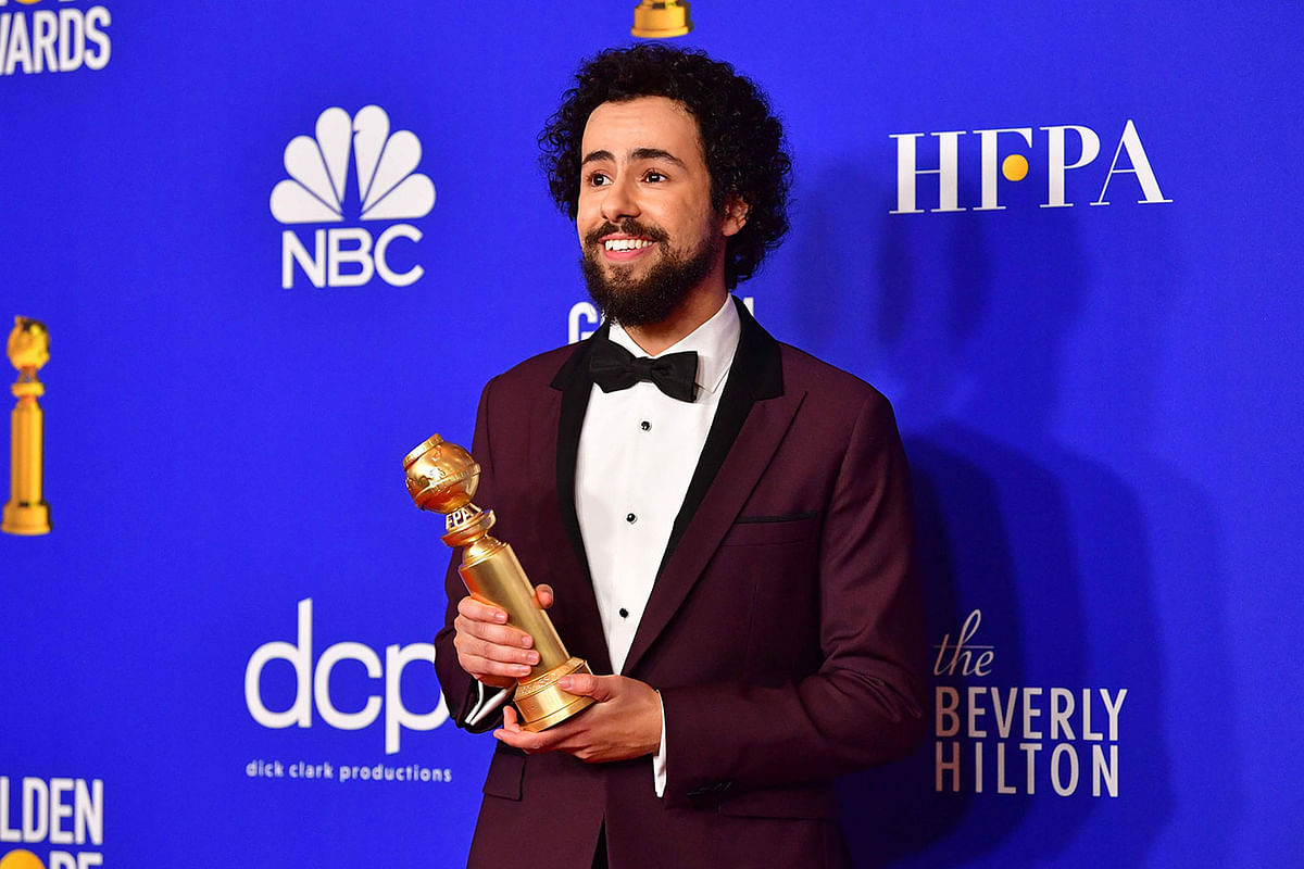 US comedian Ramy Youssef poses in the press room with the award for Best Performance by an Actor in a Television Series - Musical or Comedy during the 77th annual Golden Globe Awards on 5 January, at The Beverly Hilton hotel in Beverly Hills, California. Photo: AFP