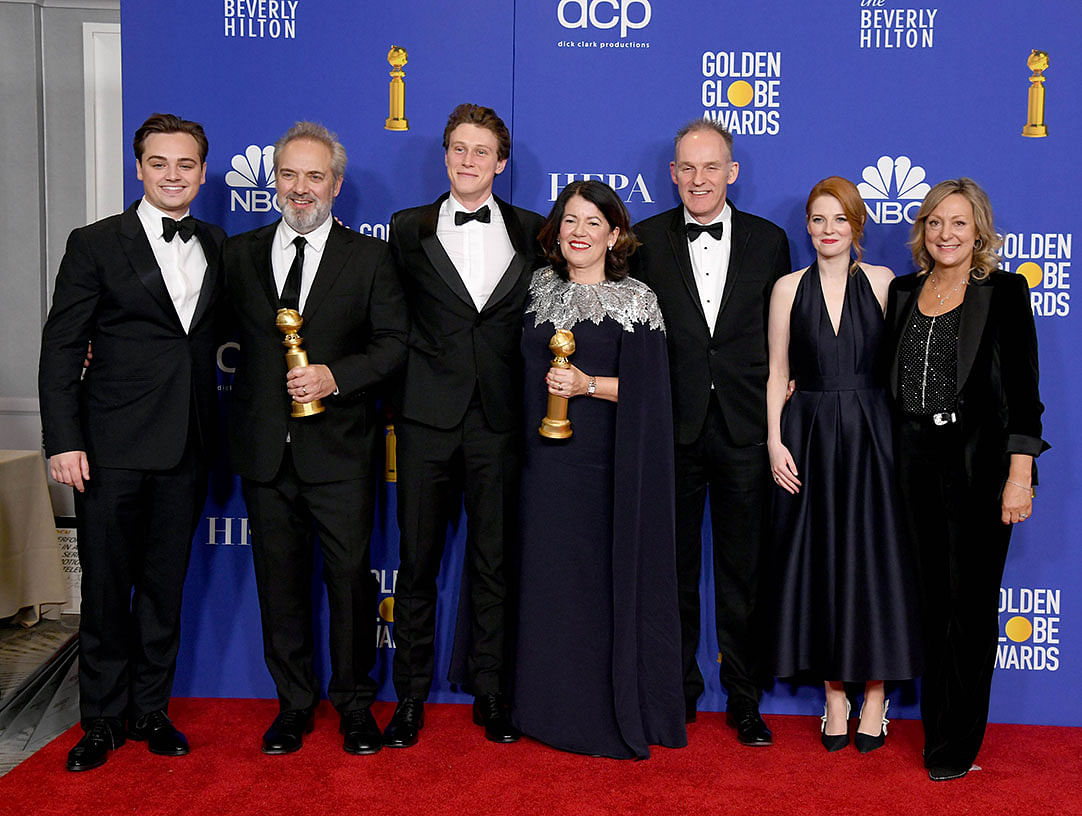 (L-R) Dean-Charles Chapman, Sam Mendes, George MacKay, Pippa Harris, Callum McDougall, Krysty Wilson-Cairns, and Jayne-Ann Tenggre of the film `1917,` winner of the Best Motion Picture - Drama award, pose in the press room during the 77th Annual Golden Globe Awards at The Beverly Hilton Hotel on 5 January in Beverly Hills, California.Photo: AFP