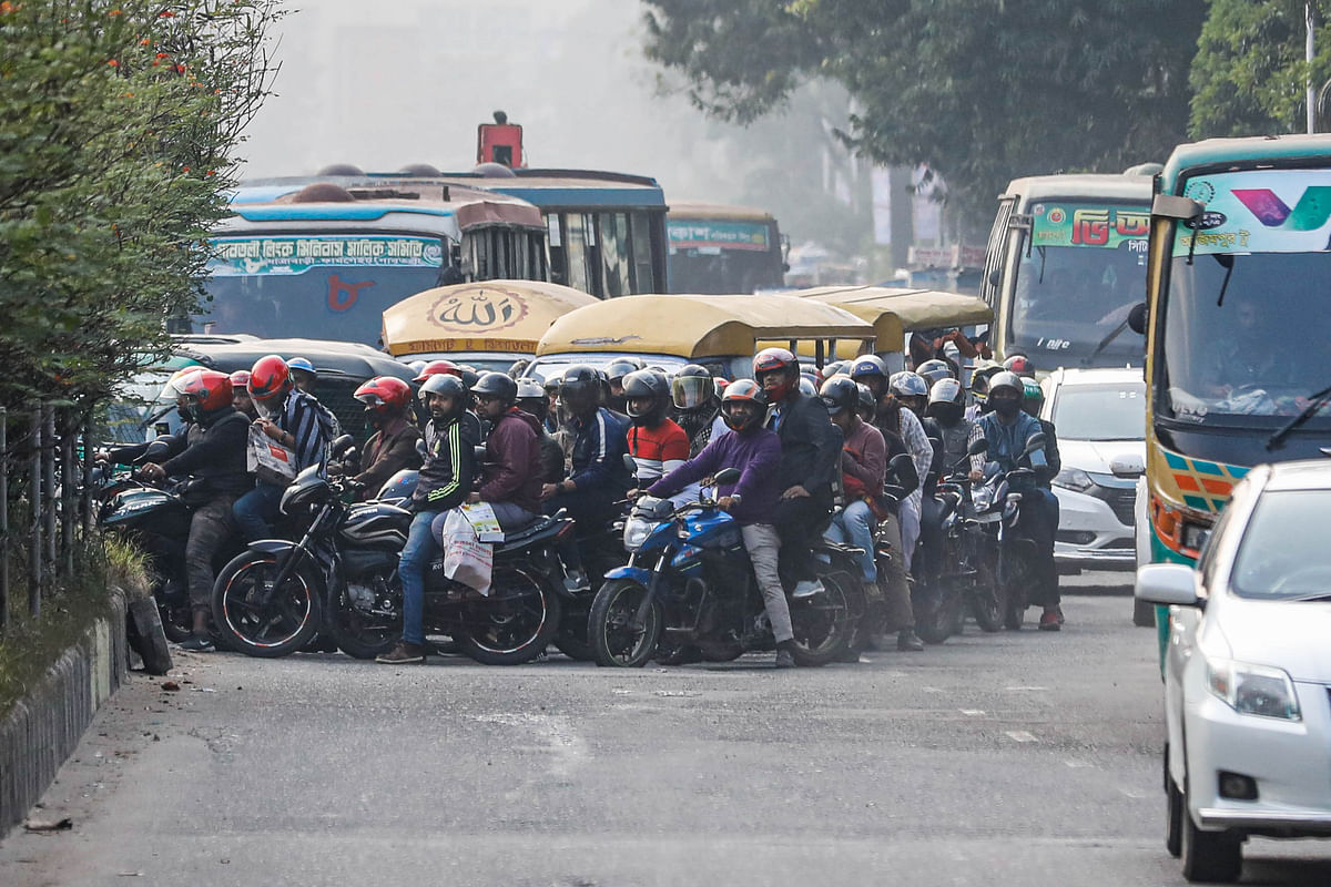 Motorcycles, human haulers and other vehicles enter a different lane flouting traffic rules at Tofazzal Hossain Manik Miah Avenue, Dhaka on 5 January 2019.  Photo: Dipu Malakar