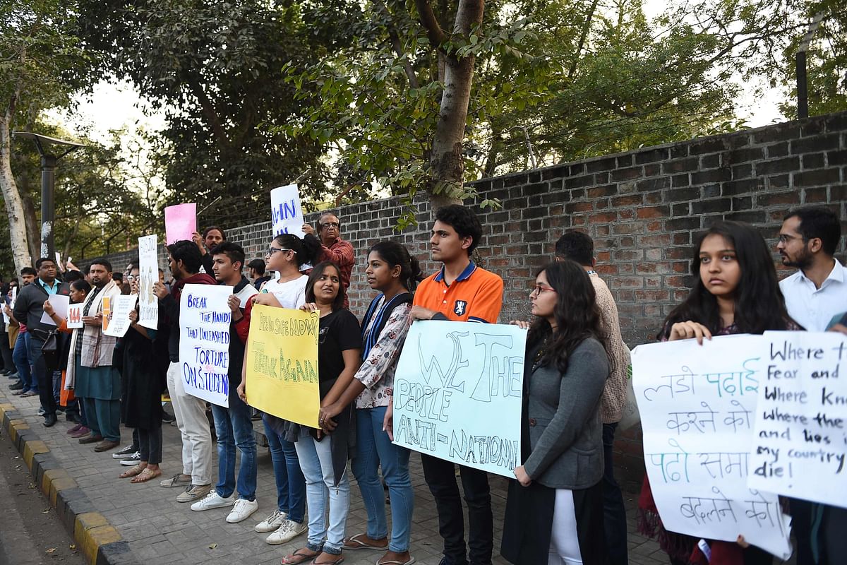 Students and supporters hold placards during a protest against an attack on the students and teachers at the Jawaharlal Nehru University (JNU) campus in New Delhi a day before, outside the Indian Institute of Management (IIM) in Ahmedabad on 6 January 2020. Protests were held across India on January 6 after masked assailants wielding batons and iron rods went on a rampage at a top Delhi university, leaving more than two dozen injured. Photo: AFP