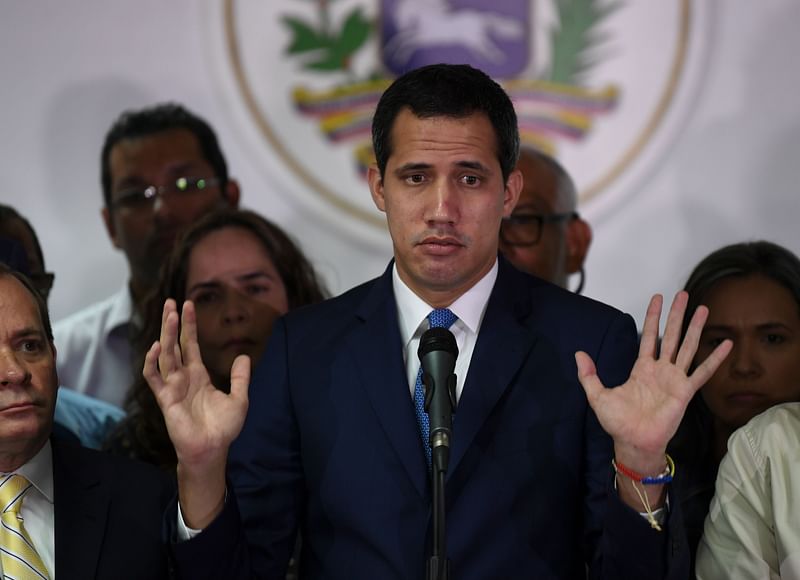 Venezuelan opposition leader and self-proclaimed acting president Juan Guaido gestures during a press conference a day after a controversial parliament voting, in Caracas, on 6 January. Photo: AFP