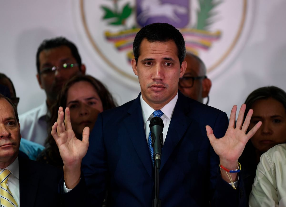 Venezuelan opposition leader and self-proclaimed acting president Juan Guaido gestures during a press conference a day after a controversial parliament voting, in Caracas, on 6 January. Photo: AFP