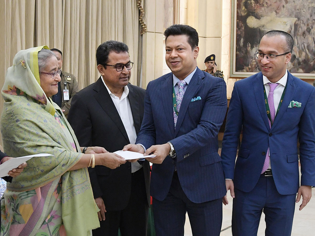 City Bank chairman Aziz Al Kaiser, along with the bank’s MD and CEO Mashrur Arefin, hand over cheque to PM Sheikh Hasina at Gonobhaban for Bangabandhu birth centenary celebrations