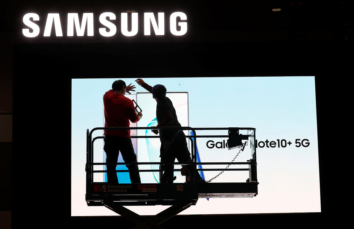 Workers set up a Samsung display in the lobby of the Las Vegas Convention Center in preparation for the 2020 CES in Las Vegas, Nevada, US on 5 January. Photo: AFP