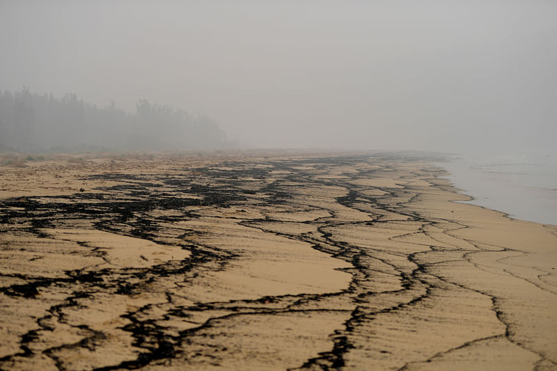 Ash and fire debris are washed up on Boydtown Beach near the Nullica River in Eden, Australia on 7 January. Photo: Reuters