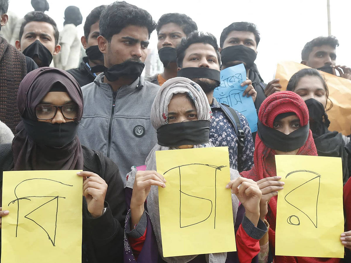 Protesters stage a silent rally on 7 January 2019 on the Dhaka University campus seeking justice for a female student who was raped in the capital`s Kurmitola on 5 January. Photo: Sajid Hossain