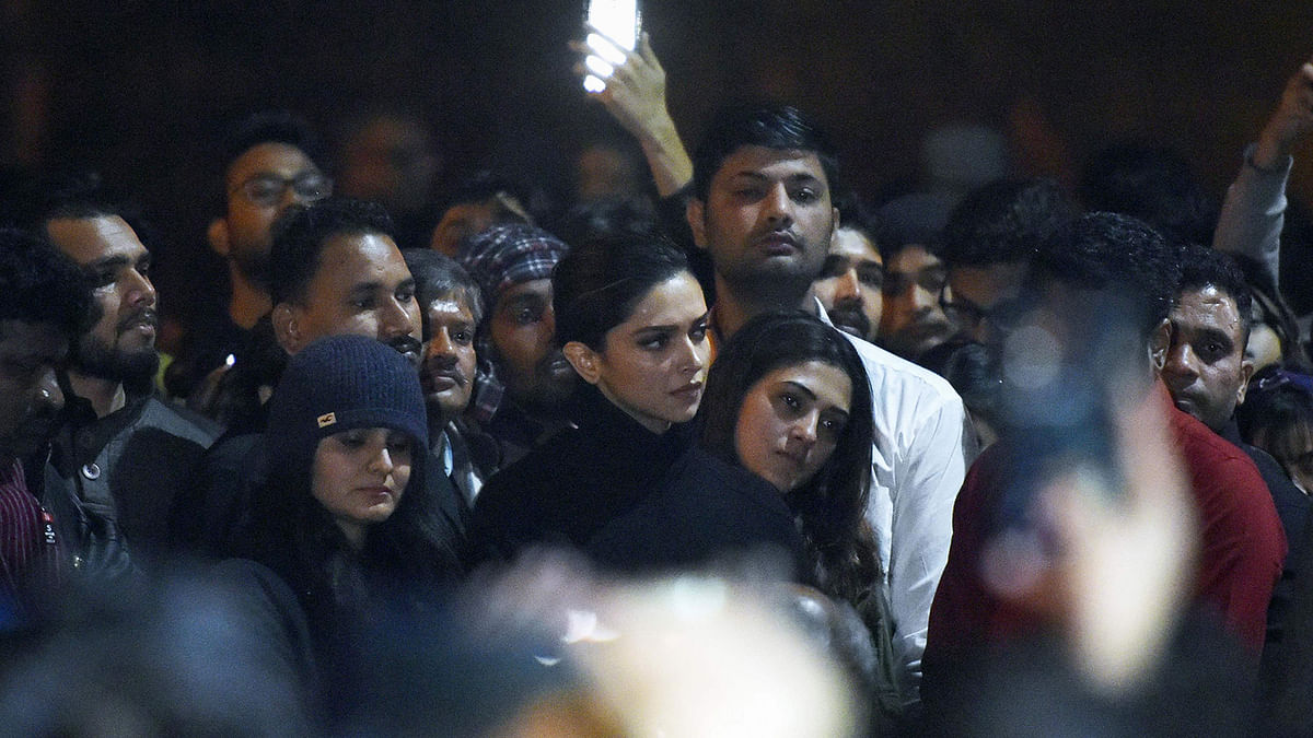 In this photo taken on 7 January 2020, Bollywood actress Deepika Padukone (C) visits students protesting at Jawaharlal Nehru University (JNU) against a recent attack at JNU on students and teachers in New Delhi. Protests have been held across India after masked assailants wielding batons and iron rods went on a rampage at a top Delhi university, leaving more than two dozen injured. Photo: AFP