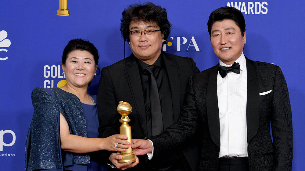 L-R) Lee Jung Eun, Bong Joon-ho, and Song Kang-ho pose in the press room with award for Best Motion Picture - Foreign Language for `Parasite` during the 77th Annual Golden Globe Awards at The Beverly Hilton Hotel on January 05, 2020 in Beverly Hills, California. Photo: AFP