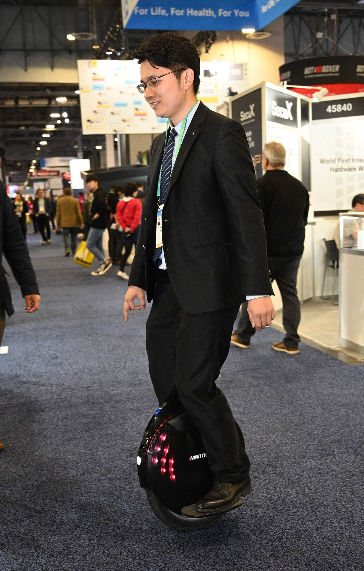 Jason Jiao of Shenzhen, China-based Inmotion Technologies rides Inmotion`s newest monowheel, the Inmotion V8F at the 2020 Consumer Electronics Show (CES) in Las Vegas, Nevada on 9 January 2020. Photo: AFP