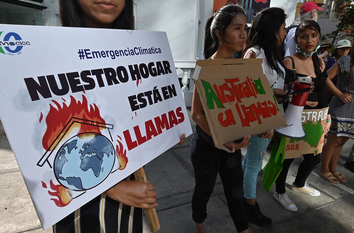 Climate activists and members of the environmentalist groups as Citizen Movement Against Climate Change and Fridays For Future, protest outside the Australian embassy in Lima on 10 January 2020, against the Australia`s energy and climate policy as deadly climate-fuelled bushfires burned out of control. Photo: AFP