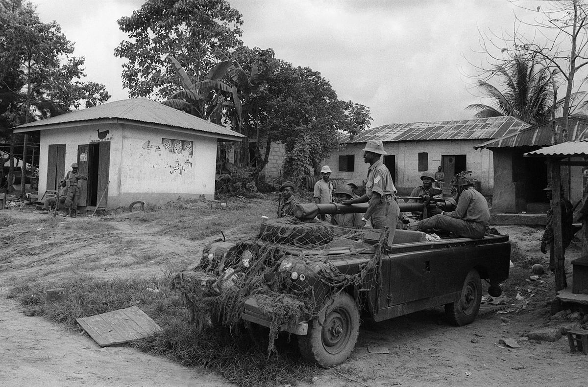 In this file photograph taken on 1 November, 1967, Nigerian federal troops man the Nine-mile Corner checkpoint in Enugu, former capital of the short-lived nation of the Republic of Biafra, after it was captured by Nigerian troops on 28 September, 1967. Photo: AFP
