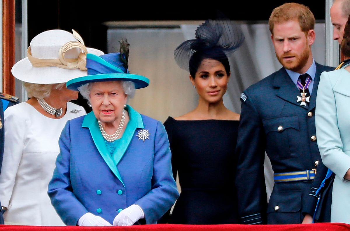 In this file photo taken on 10 July, 2018 (L-R) Britain`s Camilla, Duchess of Cornwall, Britain`s queen Elizabeth II, Britain`s Meghan, duchess of Sussex, Britain`s prince Harry, duke of Sussex, AND Britain`s prince William, duke of Cambridge come onto the balcony of Buckingham Palace to watch a military fly-past to mark the centenary of the Royal Air Force (RAF). Photo: AFP