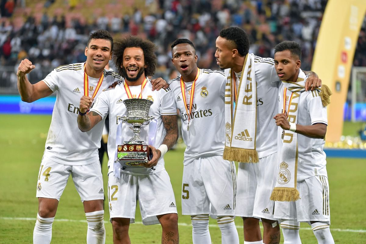 Real Madrid`s Brazilian players Casemiro, Marcelo, Vinicius Junior, Eder Militao and Rodrygo pose with the trophy after winning the Spanish Super Cup final between Real Madrid and Atletico Madrid on 12 January, 2020, at the King Abdullah Sports City in the Saudi Arabian port city of Jeddah. Photo: AFP