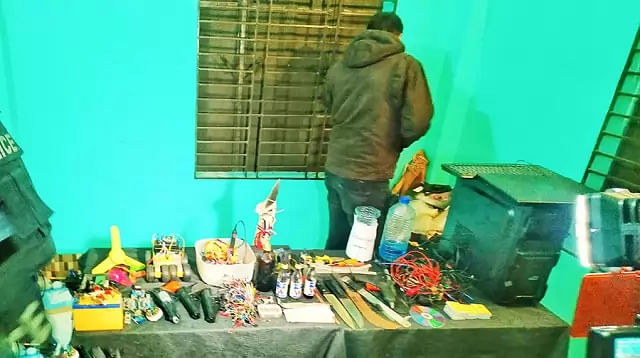 Law enforcers recovered a petrol bomb, bomb making materials, a knife and a computer CPU during a raid on a reported militant den at Savar’s Ashulia area on Monday. Photo: Maidul Islam