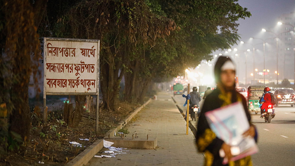 The footpath between the capital`s Banani and Nikunja area on Dhaka airport turns gloomy in the evening as there is no walkway lights there. Earlier on 5 January, a Dhaka University student was raped in the area. Without taking any security measures or arranging lights, the concerned authorities just hang up a cautionary sign there. The photo was taken on 13 January 2020 evening by Dipu Malakar.