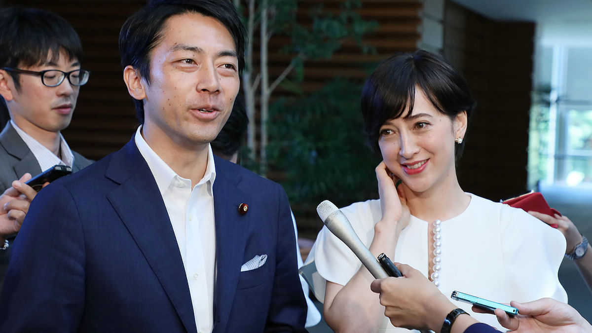 This file picture taken on 7 August 7, 2019 and shows Japan`s lawmaker Shinjiro Koizumi(L) and television anchorwoman Christel Takigawa (R) speaking to the media at prime minister`s office in Tokyo. Japanese environment minister Shinjiro Koizumi said January 15 he would take paternity leave, the first such declaration by a serving cabinet minister in a nation struggling with the world`s lowest birthrates. Photo: AFP