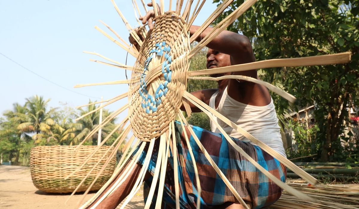 A man makes a basket with bamboo slats at Golna, Dumuria in Khulna on 15 January 2020. Photo: Saddam Hossain