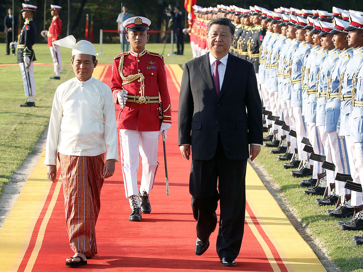 Chinese president Xi Jinping and Myanmar president Win Myint walk during a welcome ceremony at the Presidential Palace in Naypyitaw, Myanmar on 17 January 2020. Photo: Reuters