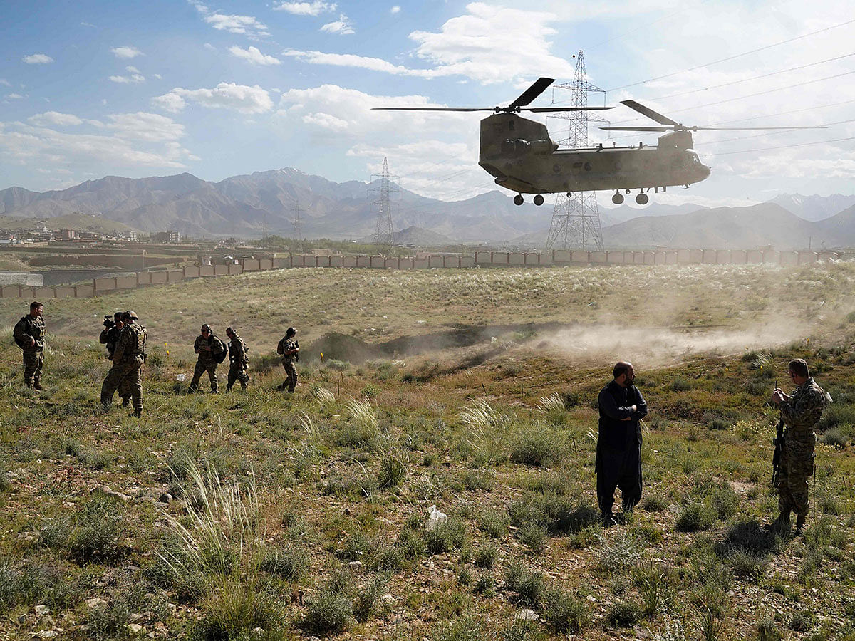 In this file photo taken on 6 June 2019, a US military Chinook helicopter lands on a field outside the governor`s palace during a visit by the commander of US and NATO forces in Afghanistan, General Scott Miller, and Asadullah Khalid, acting minister of defense of Afghanistan, in Maidan Shar, capital of Wardak province. Photo: AFP