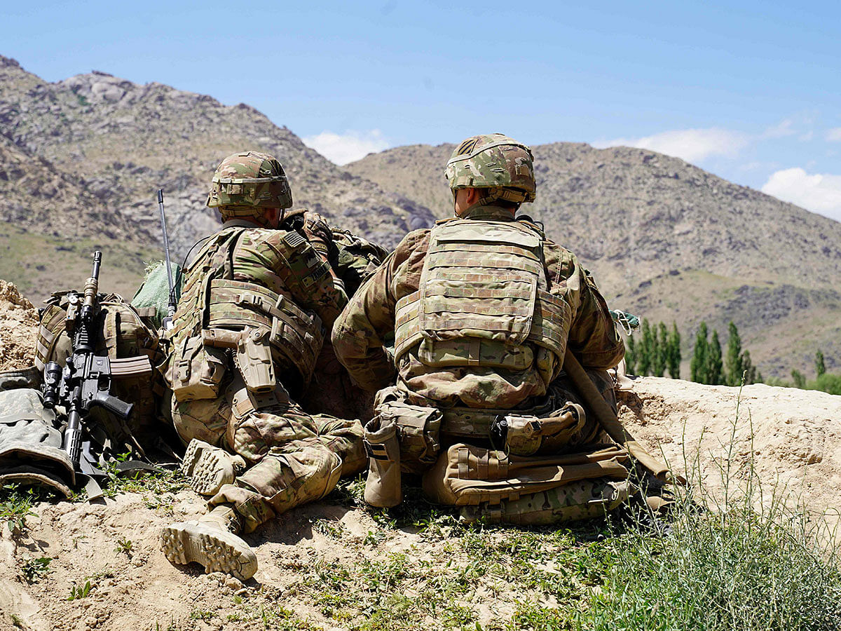 In this file photo taken on 6 June 2019, US soldiers look out over hillsides during a visit of the commander of US and NATO forces in Afghanistan general Scott Miller at the Afghan National Army (ANA) checkpoint in Nerkh district of Wardak province. Photo: AFP