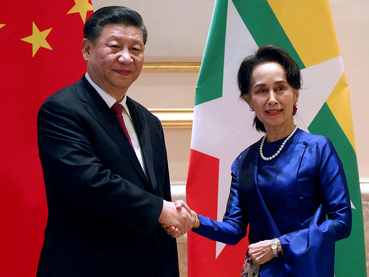 Myanmar`s State Counsellor Aung San Suu Kyi shake hands with Chinese president Xi Jinping during their meeting in Naypyitaw, Myanmar on 17 January 2020. Photo: Reuters