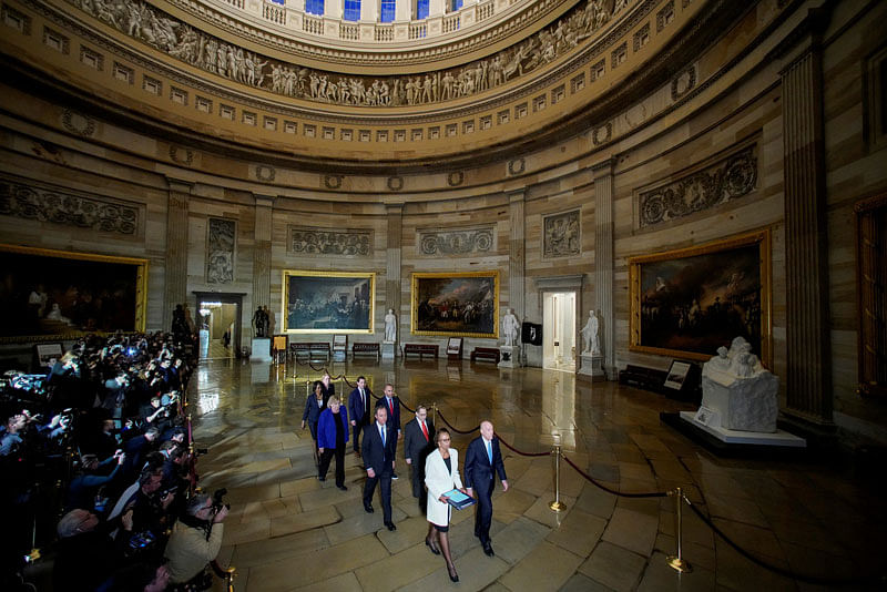 House Sergeant at Arms Paul Irving and House Clerk Cheryl Johnson carry two articles of impeachment against US president Donald Trump during a procession with the seven House impeachment managers through the Rotunda of the US Capitol to the US Senate in Washington, US, on 15 January 2020. Reuters File Photo