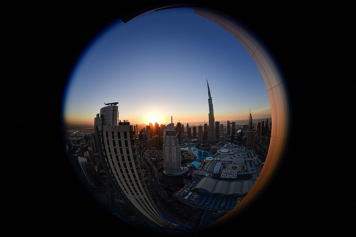 This picture taken with a fisheye lens on 18 January, 2020 shows a view of Burj Khalifa, the tallest structure and building in the world since 2009 (total heigh with antenna of 829.8 metres), in the city centre of the Gulf emirate of Dubai. Photo: AFP