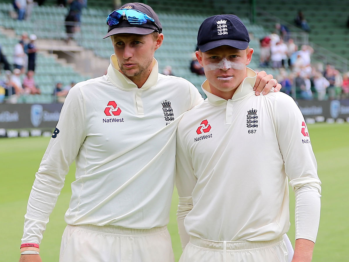 England`s Joe Root (L) and England`s Ollie Pope pose for a poartrait during the fifth day of the third Test cricket match between South Africa and England at the St George`s Park Cricket Ground in Port Elizabeth on 20 January, 2020. Photo: AFP