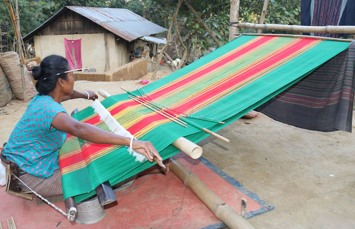A woman weaves a cloth called `Rinai` at Bangal Kati Mukh, Tripurapara in Khagrachhari on 19 January 2020. Photo: Nerob Chowdhury