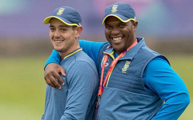 South Africa’s wicketkeeper Quinton de Kock (L) is embraced by CSA selection convenor Linda Zondi at a training session at Edgbaston in Birmingham, central England on 18 June 2019, ahead of their 2019 World Cup match against New Zealand. Photo: AFP