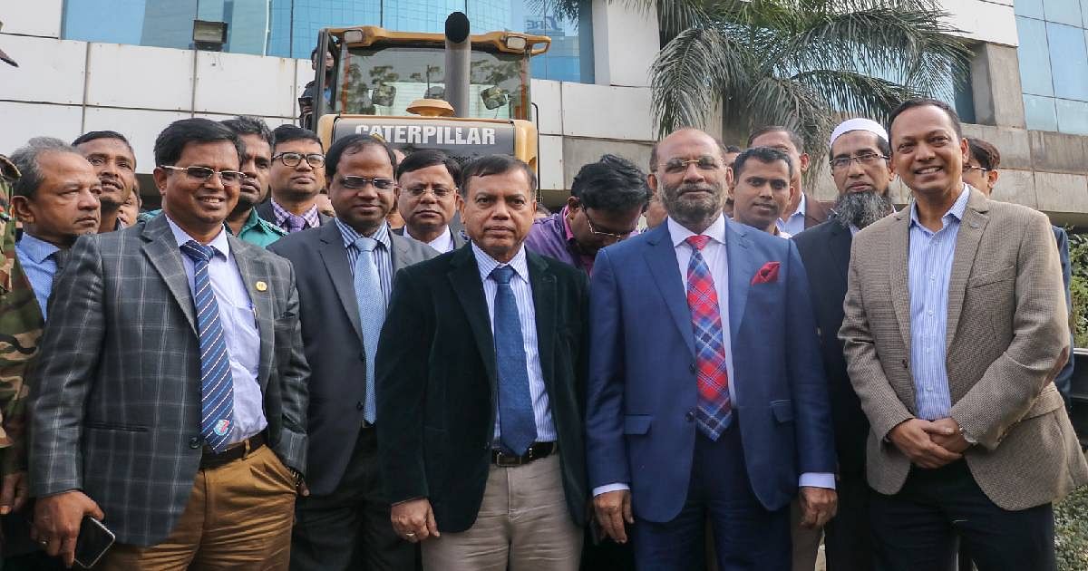Housing and public works minister SM Rezaul Karim (2nd R) poses for a photo after inaugurating the demolition work of BGMEA Bhaban in Dhaka on 22 January 2020. Photo: UNB