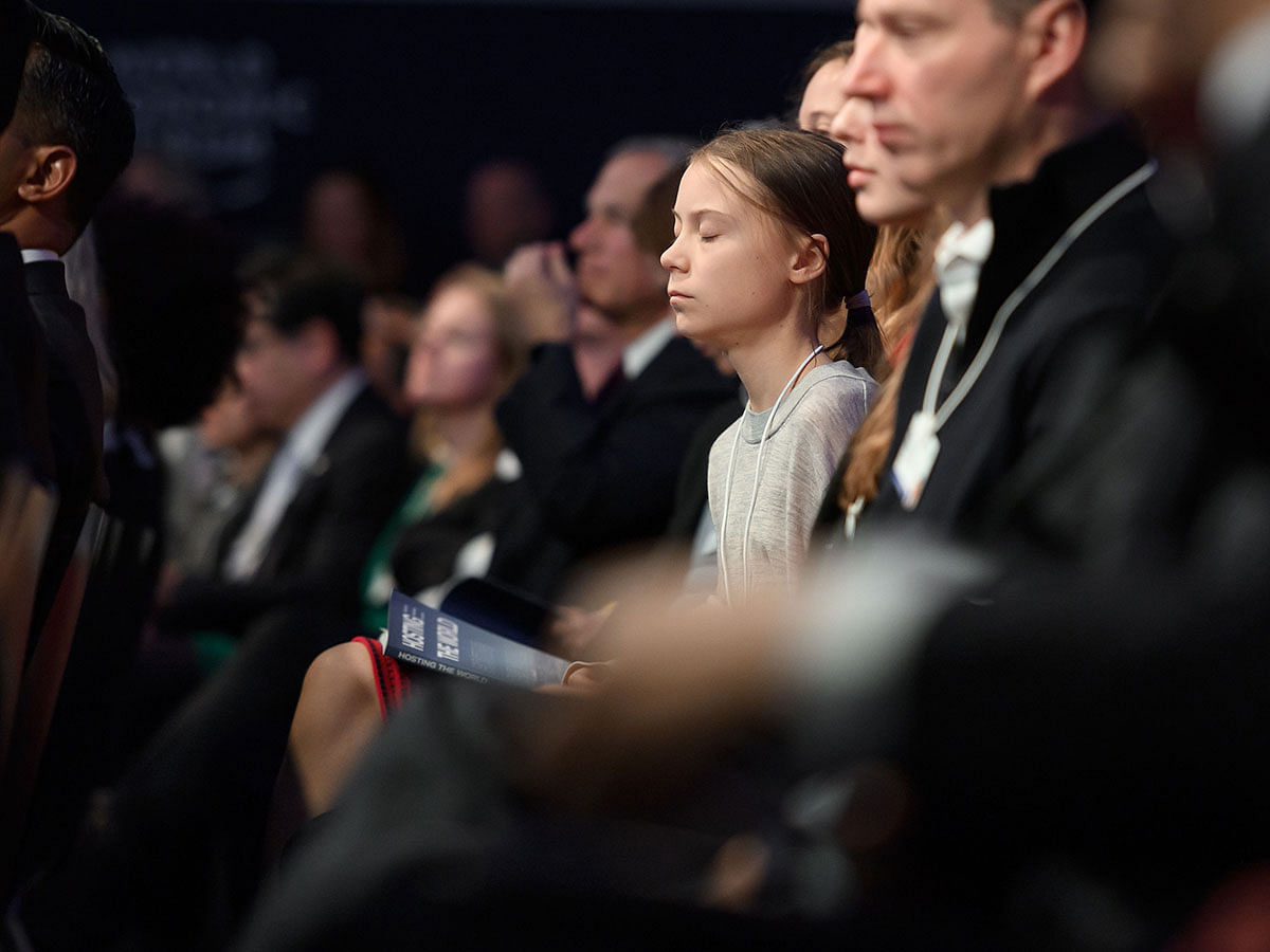 Swedish climate activist Greta Thunberg listens to the speech of US president in the Congres hall during the World Economic Forum (WEF) annual meeting in Davos, on 21 January 2020. Photo: AFP