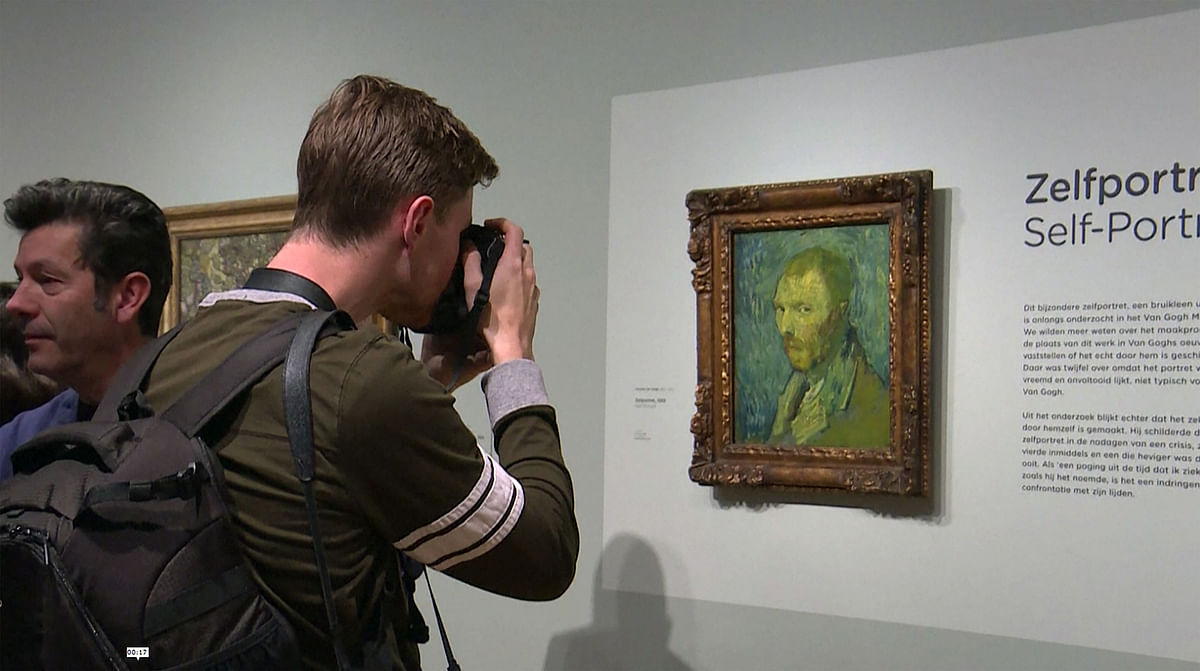 This video grab image shows a photographer taking a close up of a self-portrait by Dutch artist Vincent van Gogh on display at The Van Gogh Museum in Amsterdam on January 20, 2020, after it was declared as genuine. Photo: AFP