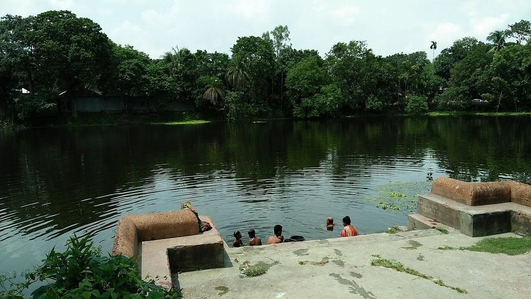 People bathing in the pond of Teota zamindar bari