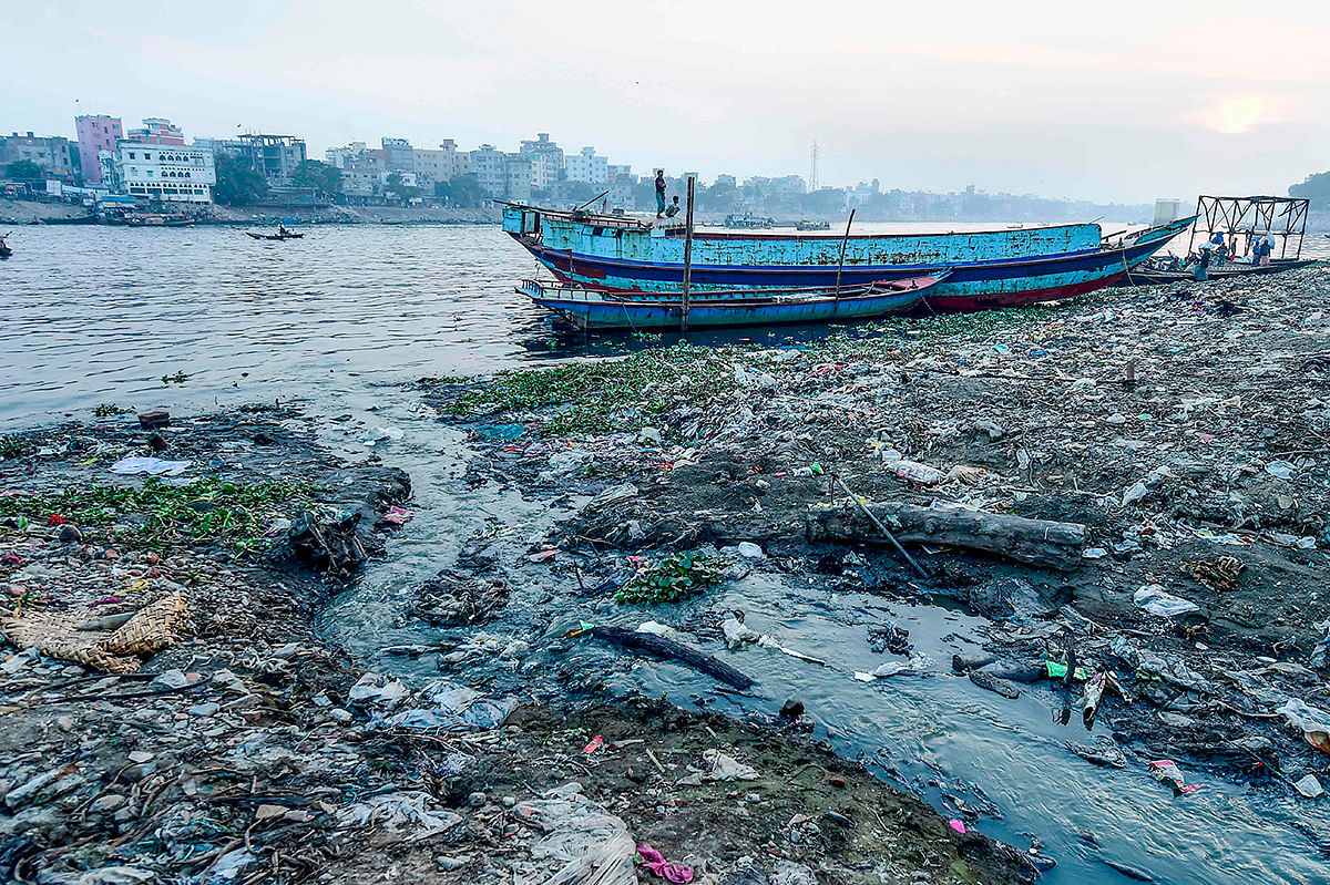 Waste water flows from the city drain into the Buriganga river in Dhaka on 21 January 2020. Photo: AFP