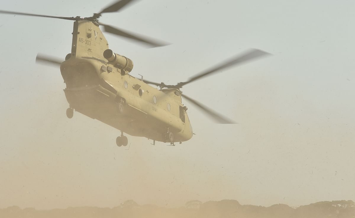 This photo taken on 16 January shows an Australian Defence Force helicopter landing on Kangaroo Island as part of the deployment of 3,000 soldiers to assist in bushfire-affected areas after they ravaged the island off of the south coast of Australia. Photo: AFP