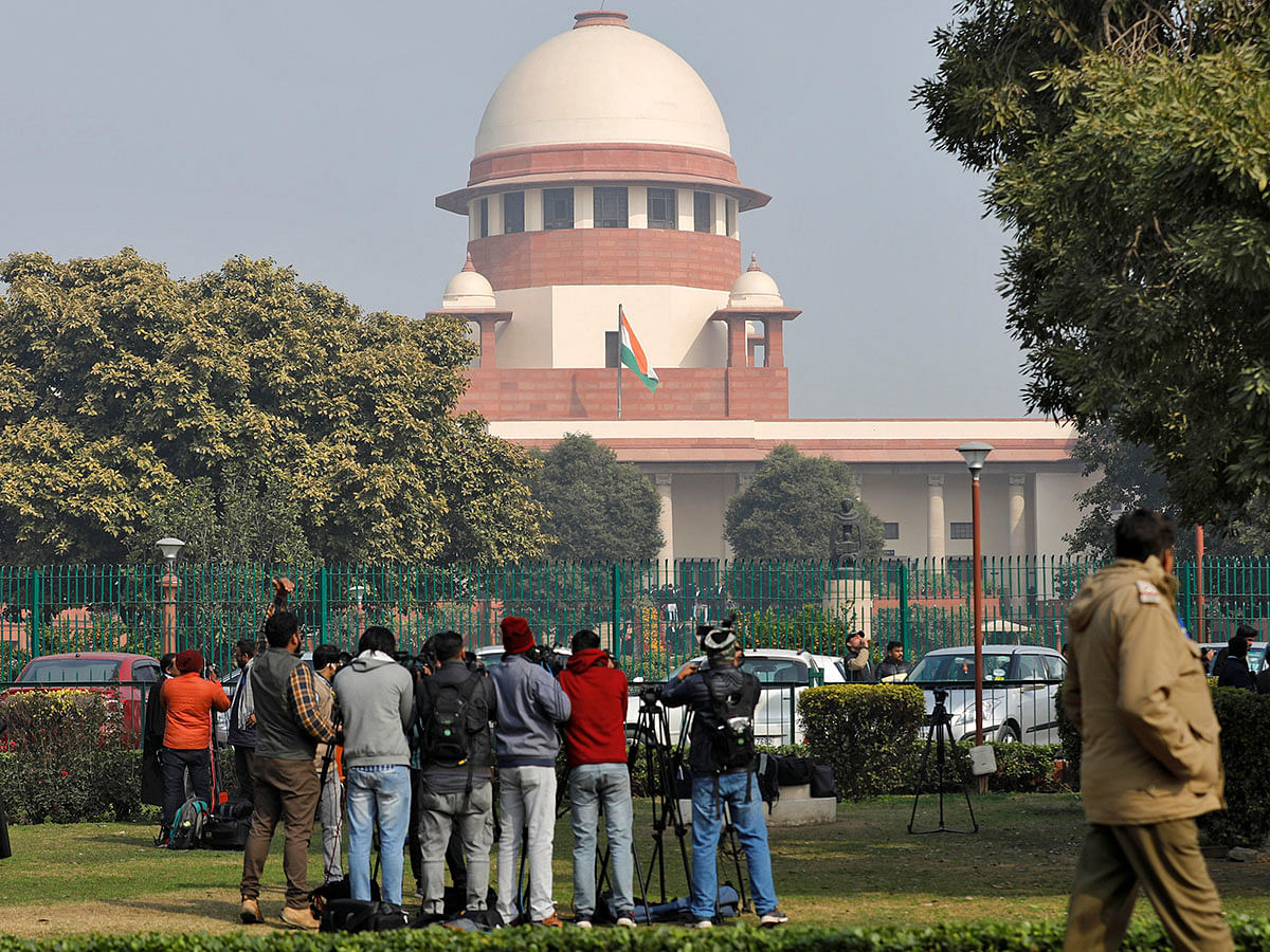 Television journalists are seen outside the premises of the Supreme Court in New Delhi, India, on 22 January 2020. Photo: Reuters