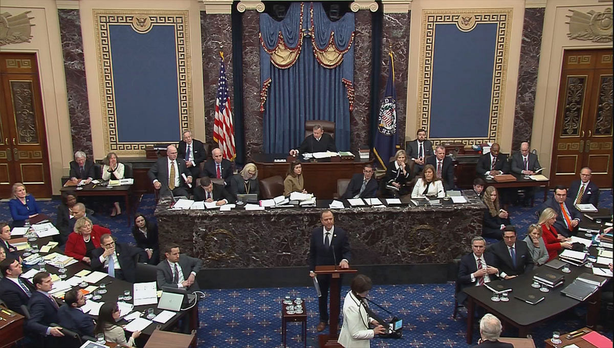 Lead manager House Intelligence Committee chairman Adam Schiff (D-CA) delivers an opening argument as Senate Majority leader Mitch McConnell (R-KY) (lowerR) prepares to speak during the second day of the Senate impeachment trial of US president Donald Trump in this frame grab from video shot in the US Senate chamber at the US Capitol in Washington, US on 22 January. Photo: Reuters