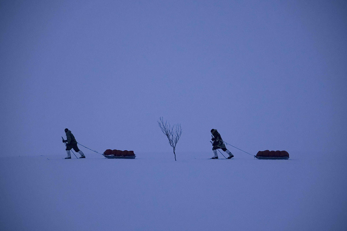 French explorers at ski Matthieu Bellanger (ahead) and Loury Lag train in Alta, Finnmark Region, Northern Norway, on 14 January, 2020, ahead of an expedition of 130 days planned at the end of February, aiming at crossing the continent from East Canada to West Alaska through the North-West route, with 60kgs of survival equipment. The French skiing explorers pull 60kgs of survival gear by - 10 Celsius degrees and in the polar night, with only 4 hours of blue day light at this time of the year, beyond the Arctic Circle. Photo: AFP
