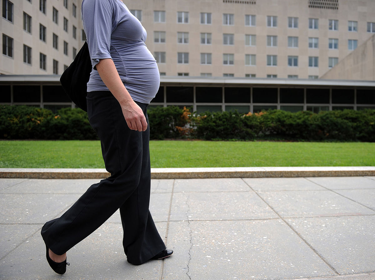 In this file photo taken on 5 August, 2010 a pregnant woman walks past the US State Department in Washington, DC. Photo: AFP
