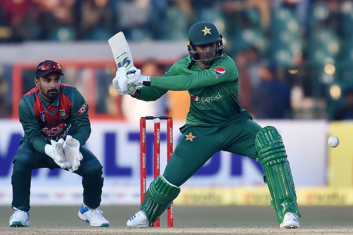 Pakistan`s Shoaib Malik (R) plays a shot as Bangladesh`s wicketkeeper Liton Das looks on during the first T20 international cricket match of a three-match series between Pakistan and Bangladesh at Gaddafi Cricket Stadium in Lahore on January 24, 2020. AFP