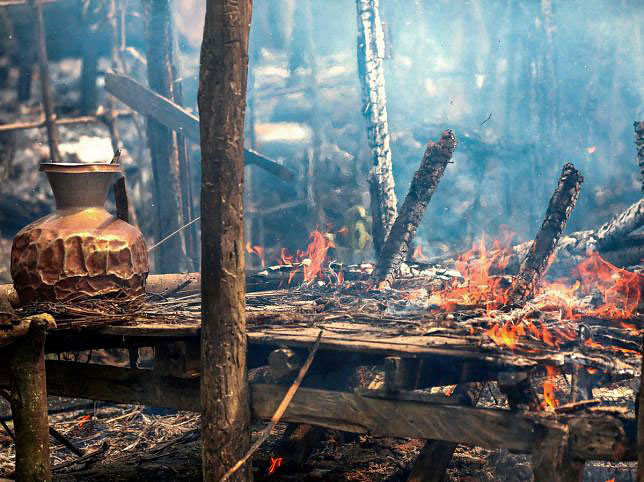 In this file photo taken on 7 September 2017, a smouldering house that was consumed by fire is seen in Gawdu Tharya village near Maungdaw in Rakhine state in northern Myanmar. Photo: AFP