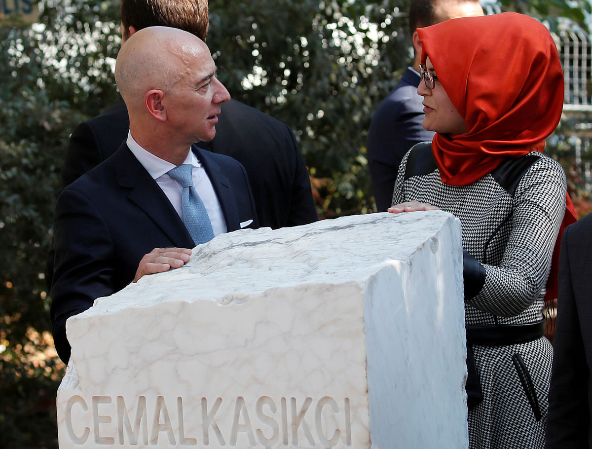 Hatice Cengiz, fiancee of the murdered Saudi journalist Jamal Khashoggi, and Jeff Bezos, founder of Amazon and Blue Origin, talk as they attend a ceremony marking the first anniversary of Khashoggi`s killing at the Saudi Consulate, in Istanbul, Turkey, on 2 October 2019. Reuters File Photo