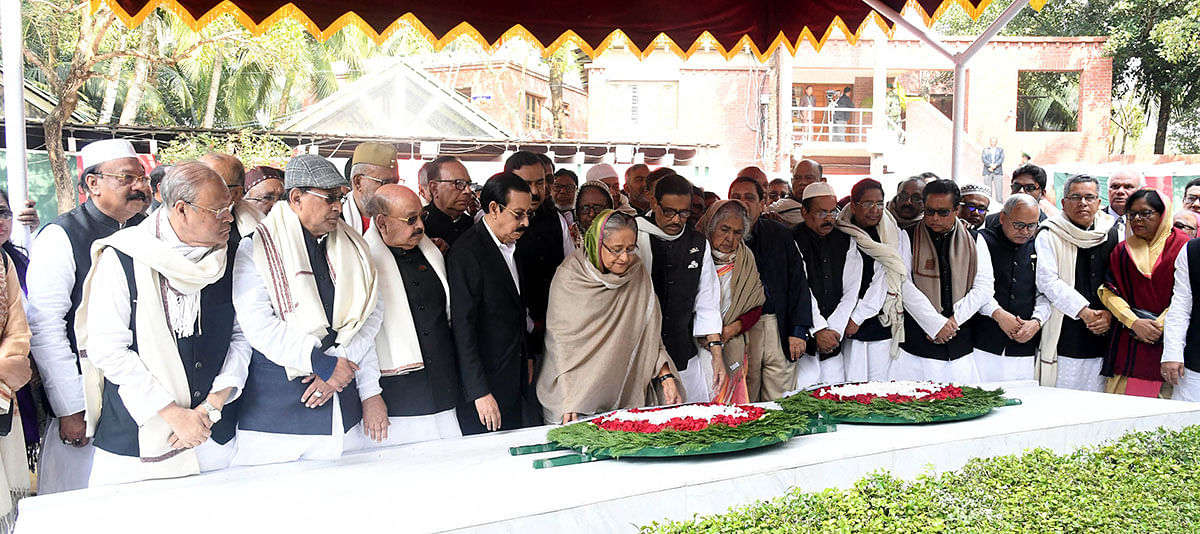 Prime minister Sheikh Hasina, also Awami League preisdent, flanked by the party leaders, pay tribute to Bangabandhu Sheikh Mujibur Rahman at his grave in Tungipara, Gopalganj on 24 January 2020. Photo: PID