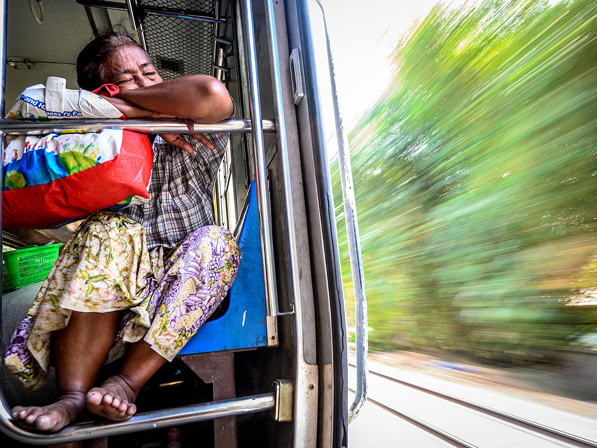 A commuter riding the Yangon Circular train on 21 January 2020. Photo: AFP