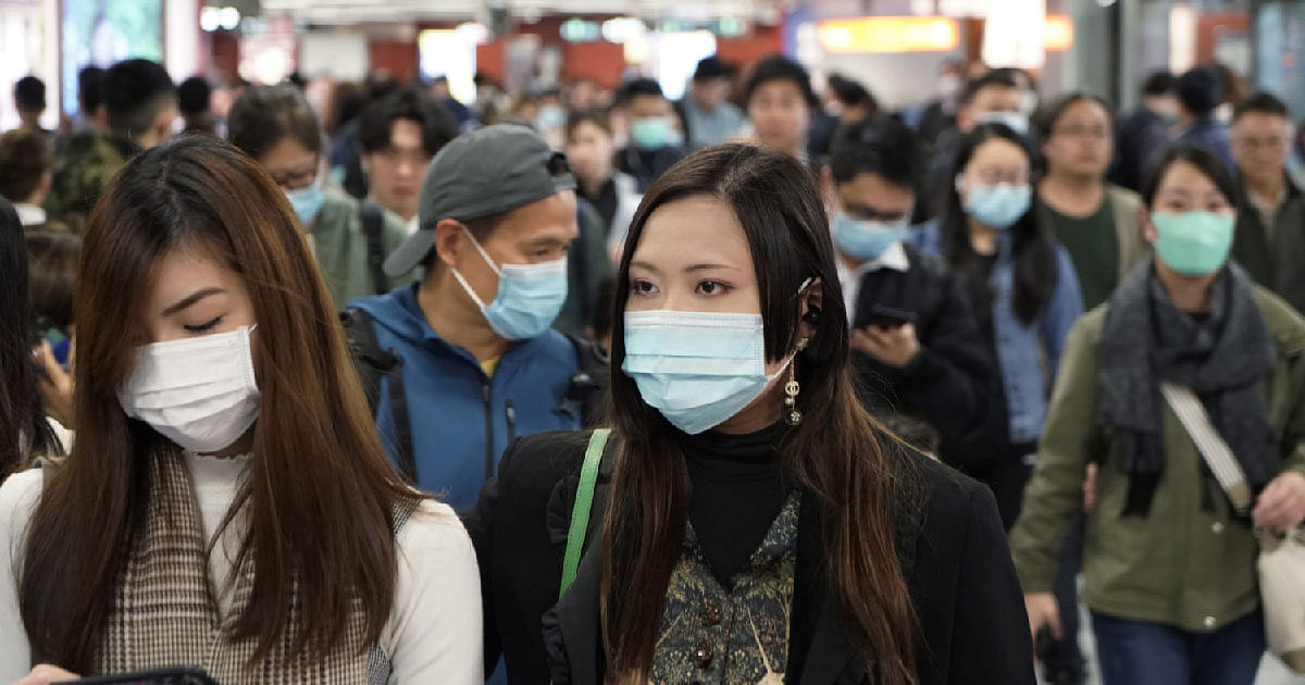 Passengers wear masks to prevent an outbreak of a new coronavirus in a subway station, in Hong Kong.File Photo:AP