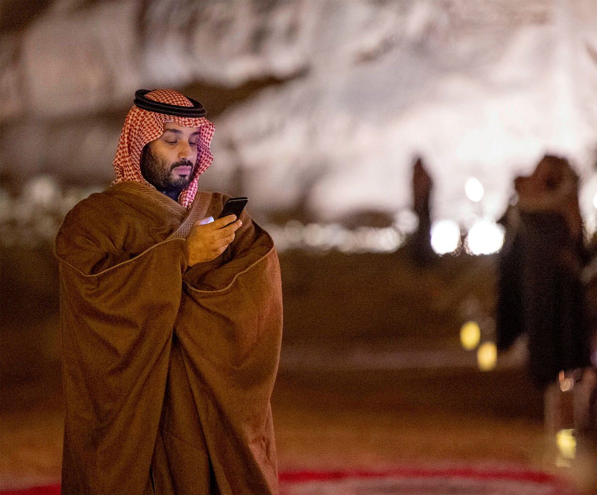 Saudi Arabia`s crown prince Mohammed bin Salman uses his phone during a meeting with Japan`s prime minister Shinzo Abe in Riyadh, Saudi Arabia on 12 January 2020. Reuters File Photo