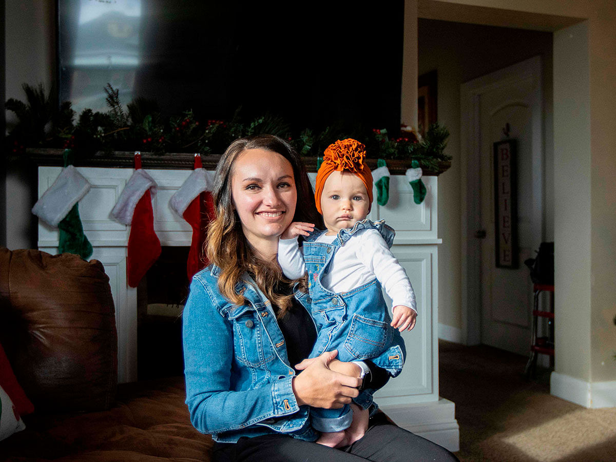 Human milk donor Annette Thompson poses with her baby, Millie, the inspiration for her milk production at their home on 13 December 2019 in Payson, Utah. Photo: AFP