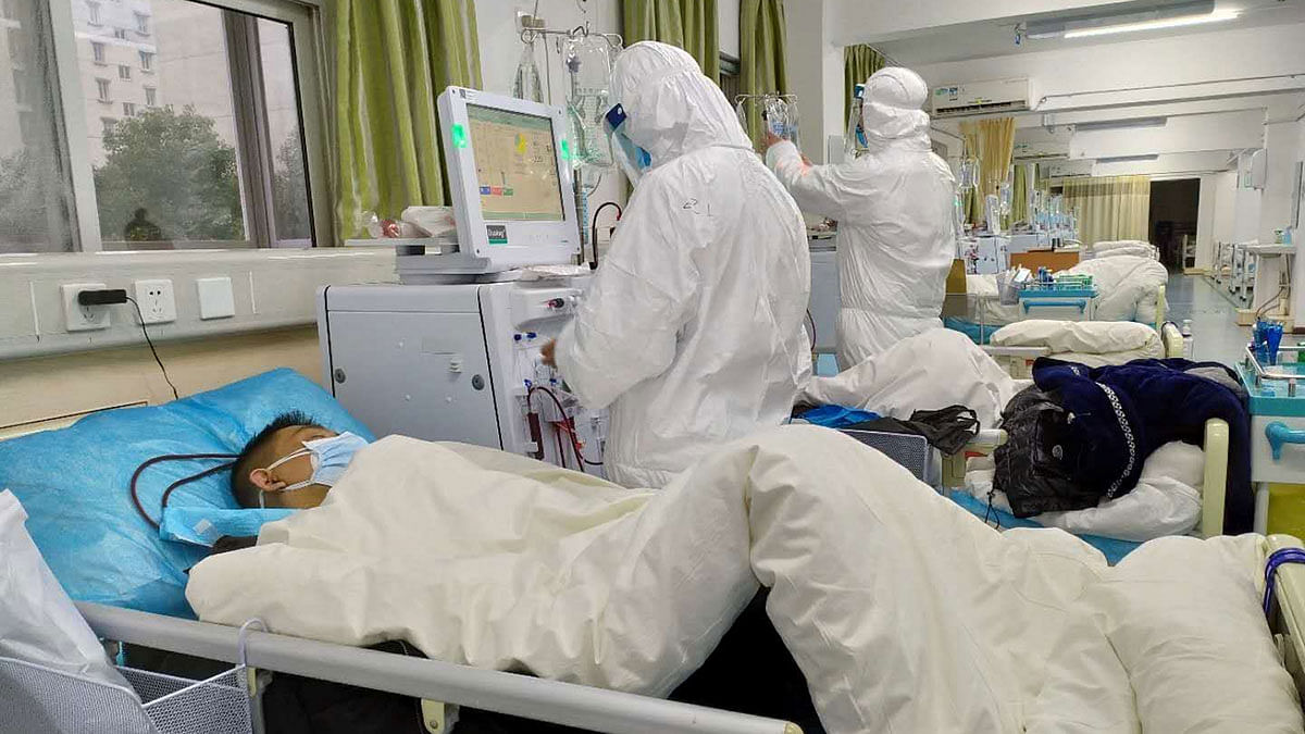 Picture uploaded to social media on 25 January 2020 by the Central Hospital of Wuhan show medical staff attending to patients, in Wuhan, China. Photo: Reuters
